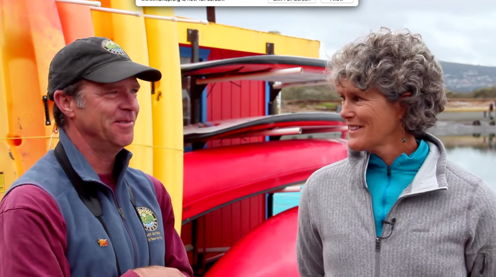 John and Virginia Flaherty talk beside the bay