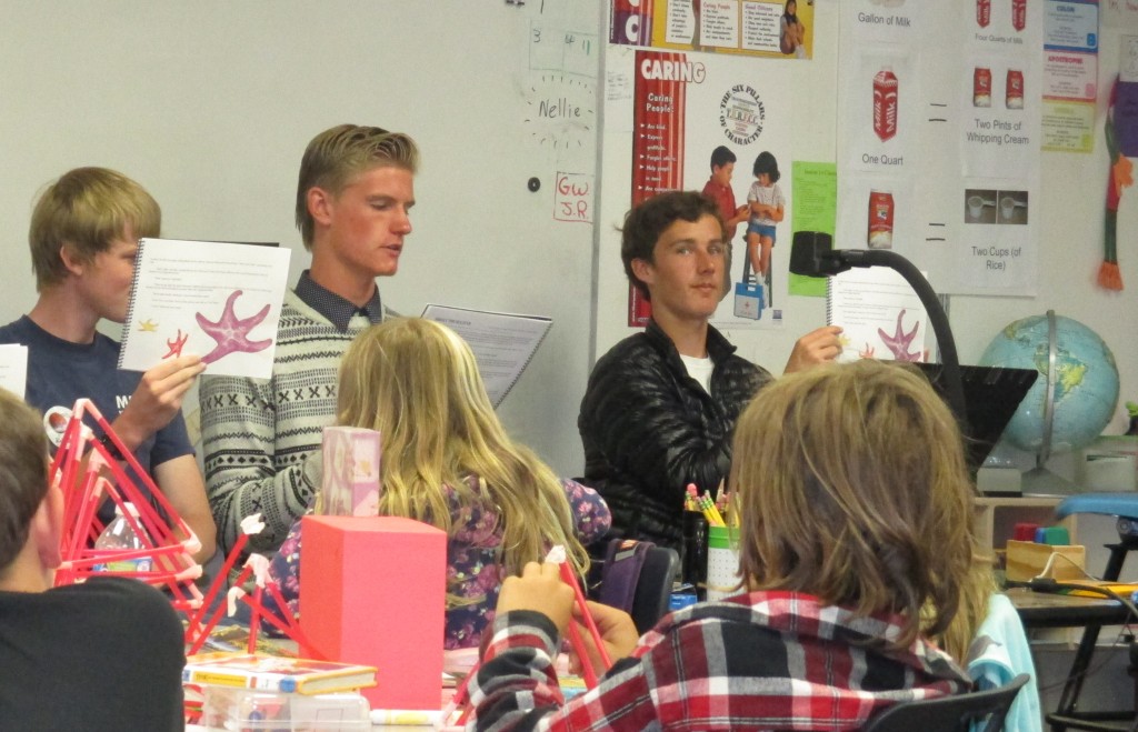 Students listen closely as Mark Olson reads about Shelley the Sea Star