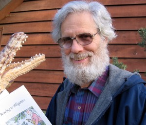 George Asdel poses with his chapbook, "Reading to Alligators."