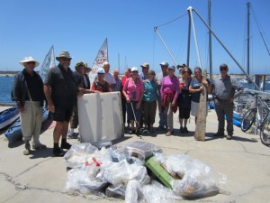 The Morro Bay Yacht Club Fun Floaters display the trash they collected during their sandspit cleanup in August.