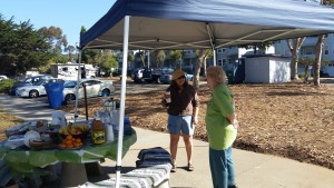 Eco Rotary Club Members Jean (left) and Ruth Ann right) take a moment to visit near the information booth. Photograph courtesy of Mary Hudson.