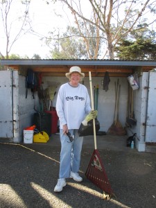 Community volunteer, Doreen, grabs some tools from the shed and gets ready to work.