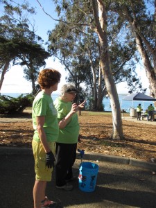 Eco Rotary Club President, Trina (right), helps a community volunteer, Charlotte (left), begin the day.