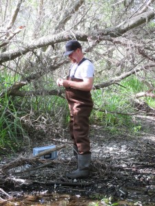 Charles Payton, Monitoring Volunteer of the Year, monitors water quality at a local creek.