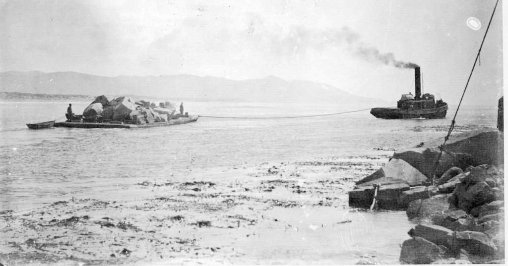 This image from the Estuary Program's archives shows a barge carrying material quarried from Morro Rock. Part of Morro Bay history. 