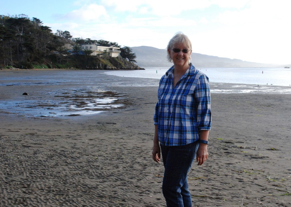 Karen stands at Windy Cove.