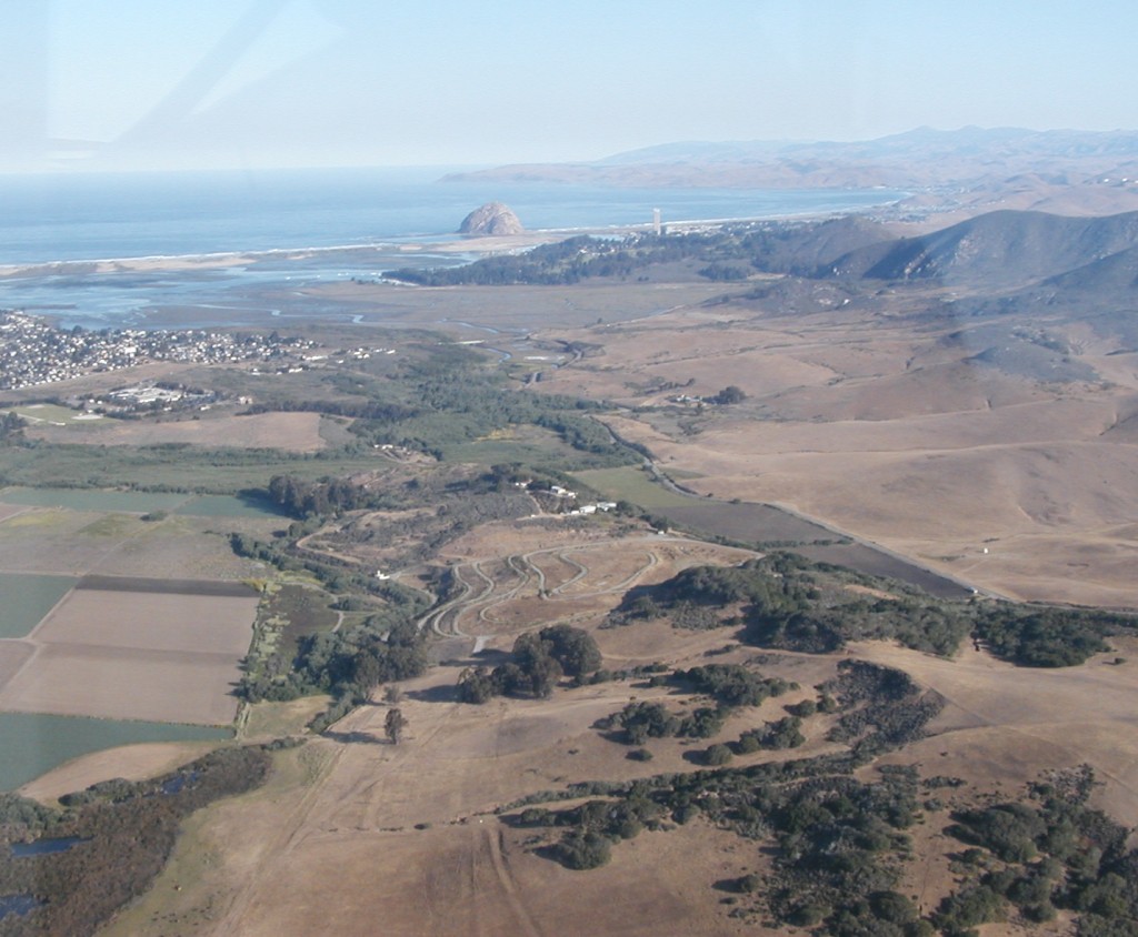 This photograph shows Morro Rock, Morro and Estero Bays, and a portion of the watershed. It was taken from the window of a plane in 1988, seven years before the establishment of the Morro Bay National Estuary Program. 