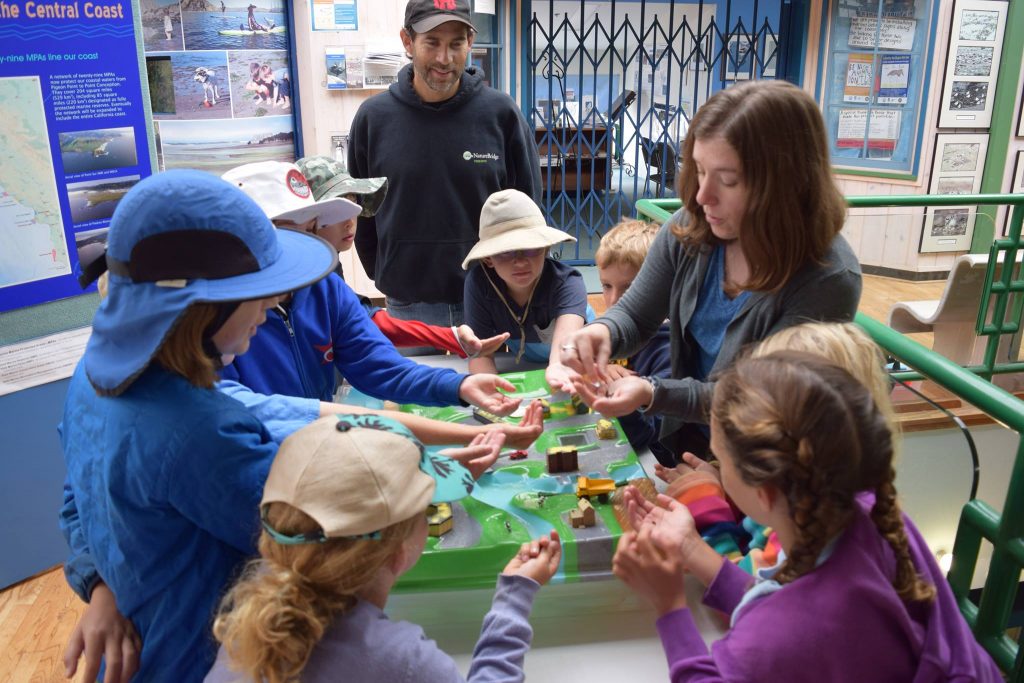 Estuary Program Communications  Outreach Coordinator, Rachel, leads a hands-on demonstration that shows students how pollution from the hills can run into the bay when it rains.