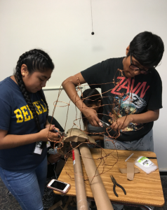 The students created a wire frame in the shape of the mermaid. and then fastened the marine debris to the frame to create the final sculpture.
