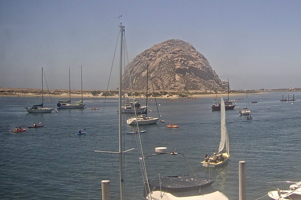 Often, that fog rolls back out to sea and people head out on the water. How many paddlers and boaters can you find in this photograph? We lost count.)