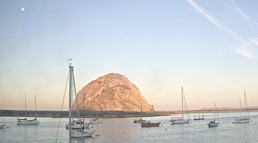 The moon set behind Morro Rock as the sun rose on this October morning.