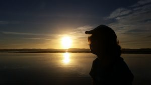 Locals and visitors alike enjoy walking along the estuary at sunset.