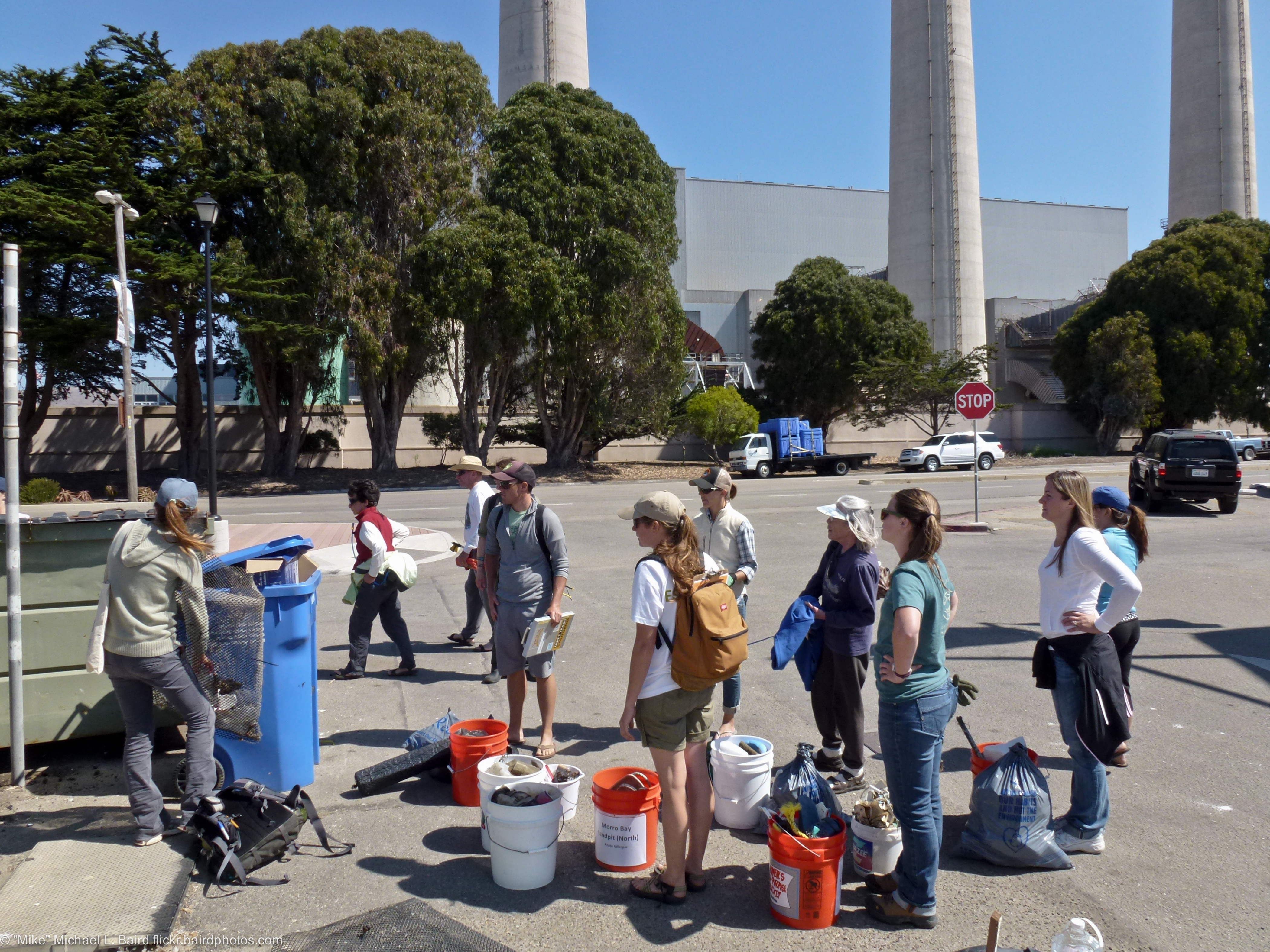 Volunteers sort recyclables after a beach cleanup