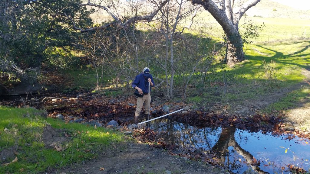 Blake, our monitoring technician, measures streamflow on Pennington Creek. 