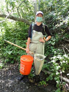 Monitoring Coordinator, Makenzie, sports a mask during fieldwork.