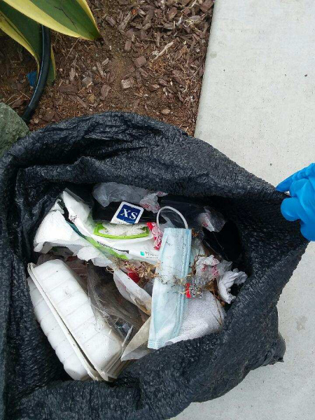 Trash including takeout containers and disposable masks found on the Morro Bay Embarcadero