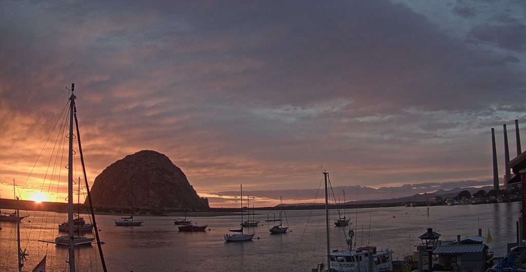 A little later on the same night, the gold, orange, and pink stripes have melded together and the sun is just about to dip behind the sandspit. 