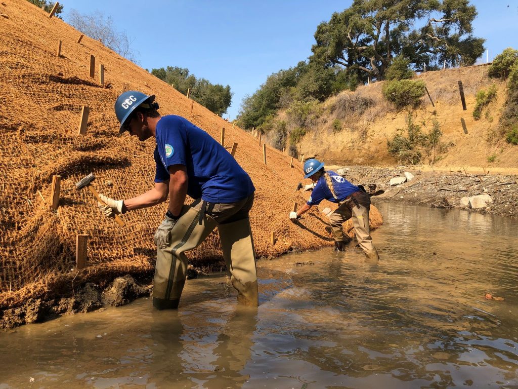 Installation of erosion control fabric to stabilize the left bank of a restoration project in the Santa Rosa Creek Watershed.
