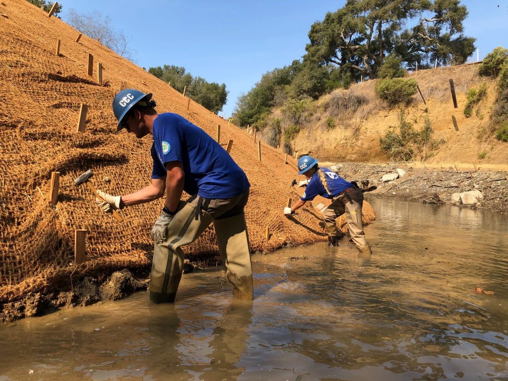 Installation of erosion control fabric to stabilize the left bank of a restoration project in the Santa Rosa Creek Watershed. 