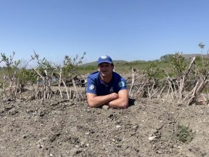 Ryan rests in a willow baffle at the Chorro Creek Ecological Reserve. Willow baffles are structures made of willow cuttings to stop sediment and control erosion in creeks.