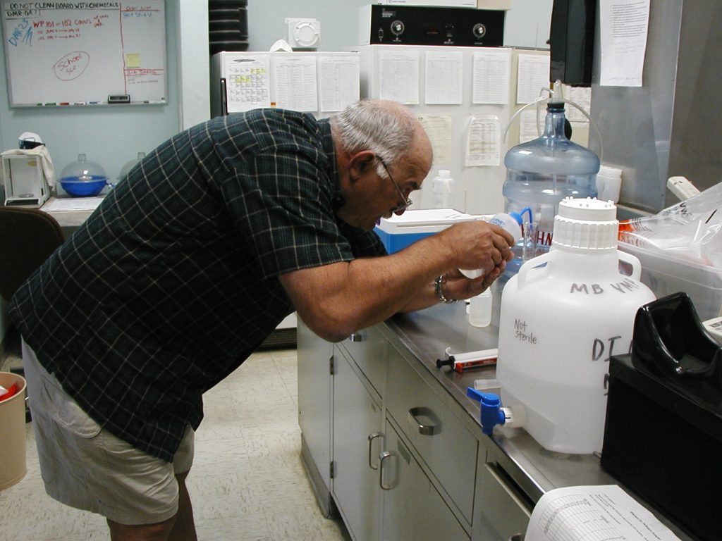 A volunteer in our previous lab space where we conducted water quality testing.