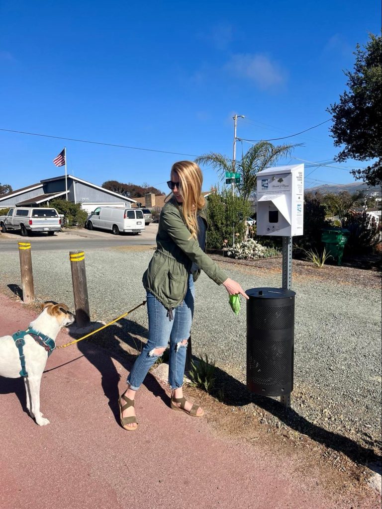 A new dispenser being used on the El Morro Bike Path in Los Osos.